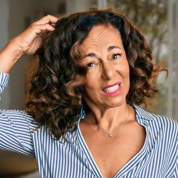 mature woman scratching her head