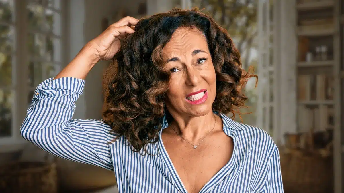 mature woman scratching her head