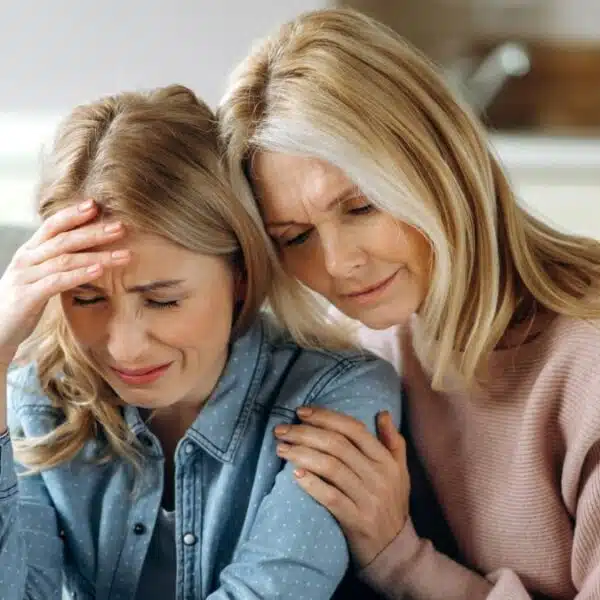 mother daughter crying at home