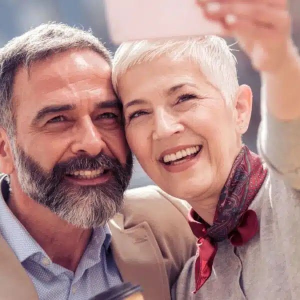 senior couple taking a selfie