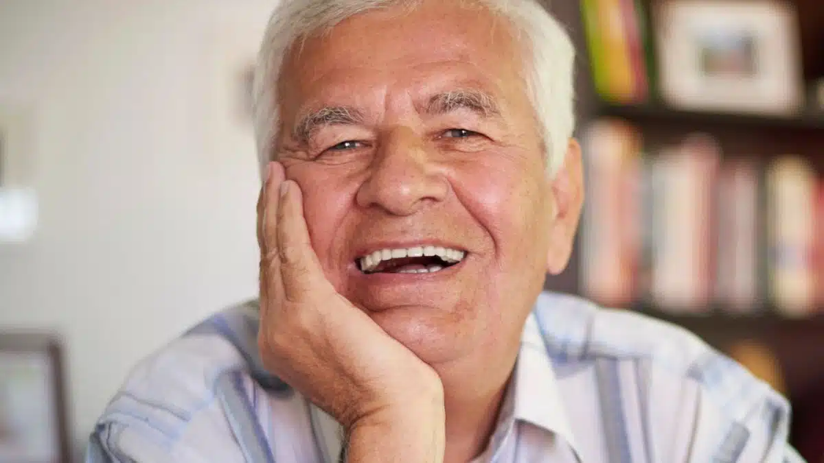 senior man smiling at home