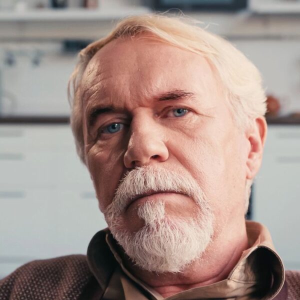 senior man tired sitting alone