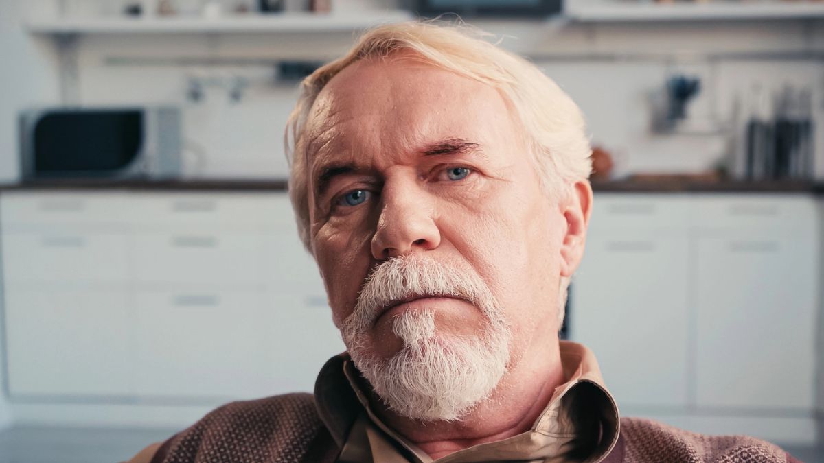 senior man tired sitting alone