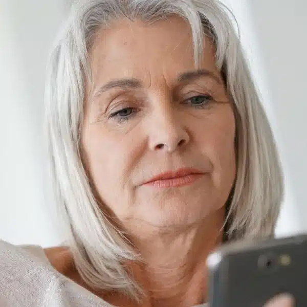 senior woman looking at a phone