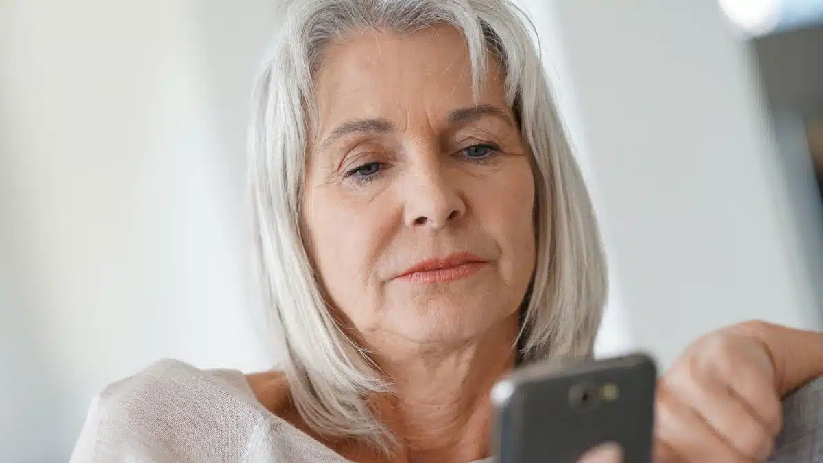 senior woman looking at a phone