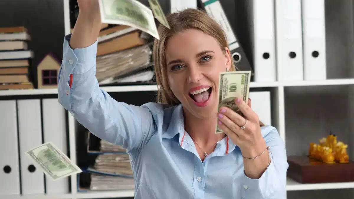 woman counting money in the air