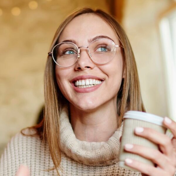 woman drinking coffee at shop