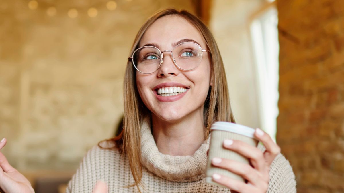 woman drinking coffee at shop