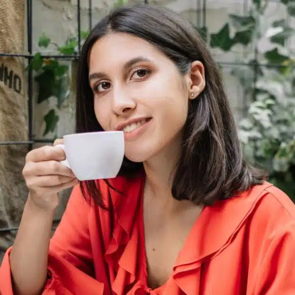 woman drinking coffee outside