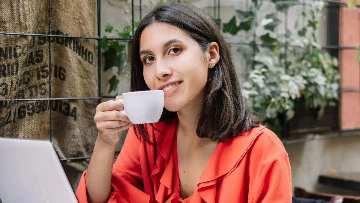 woman drinking coffee outside