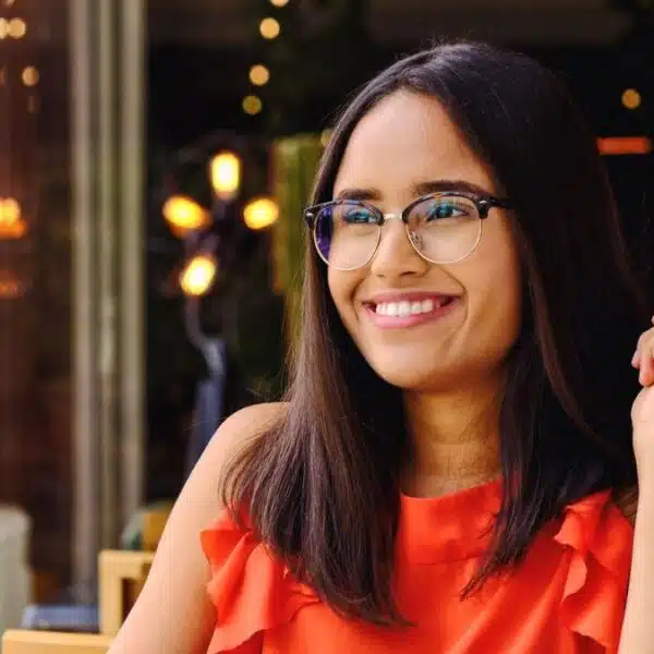 woman eating food alone glasses