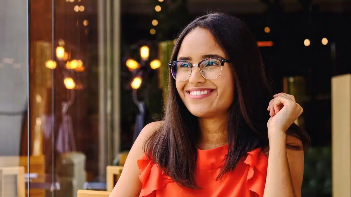 woman eating food alone glasses