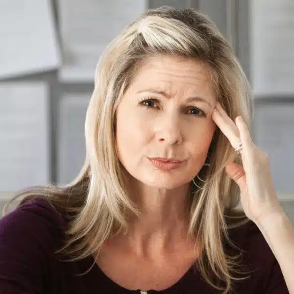 woman frown in the office cubicle
