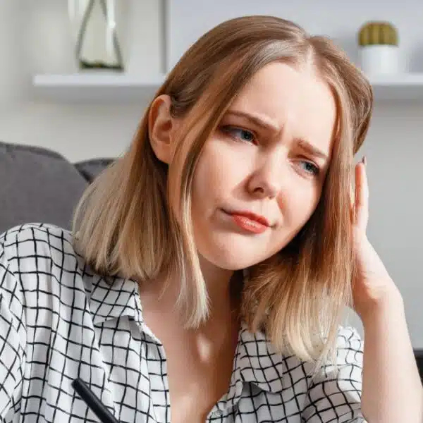 woman frowning in front of laptop