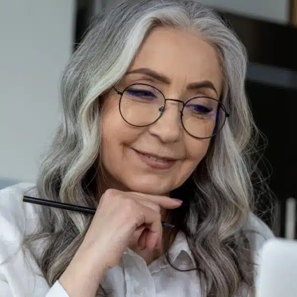 woman glasses reading a book