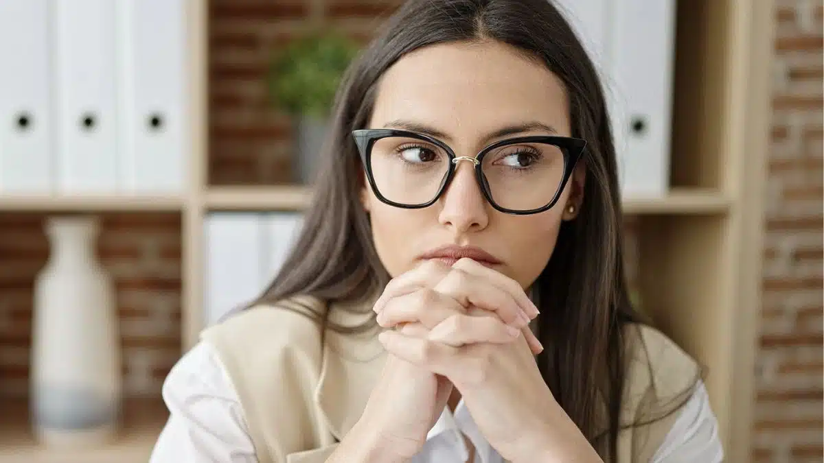 woman glasses thinking at work