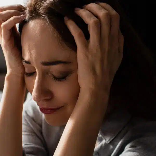 woman holding her about regret