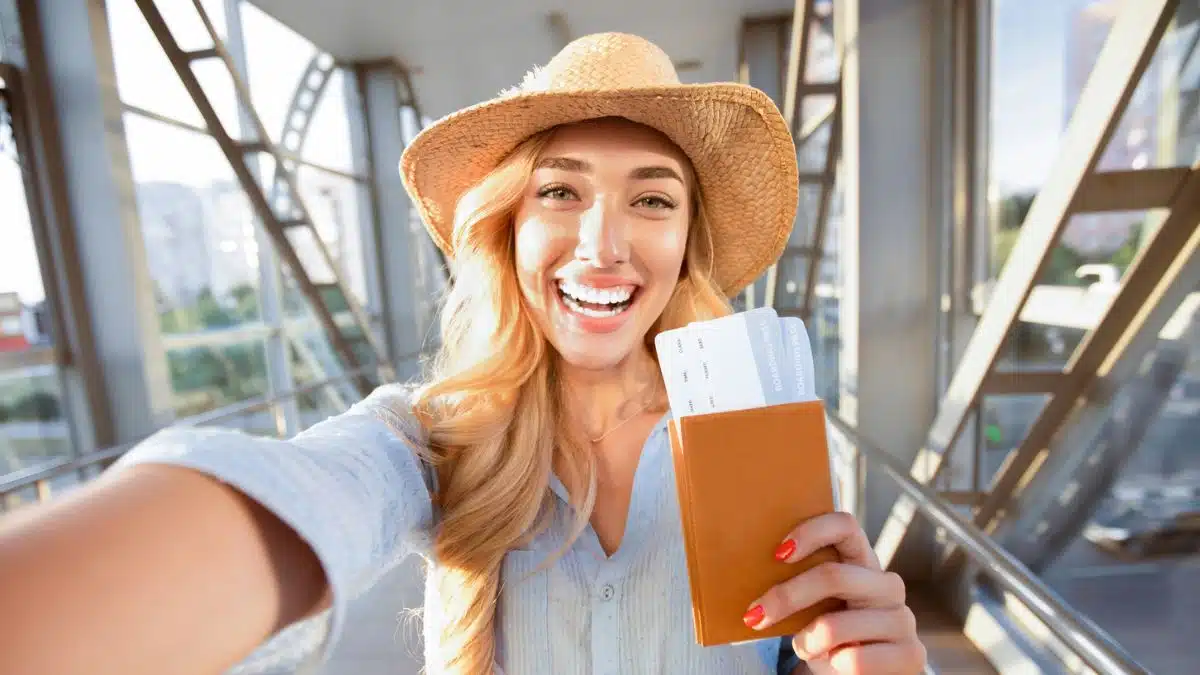 woman holding her wallet and passport