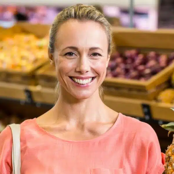 woman holding pineapple