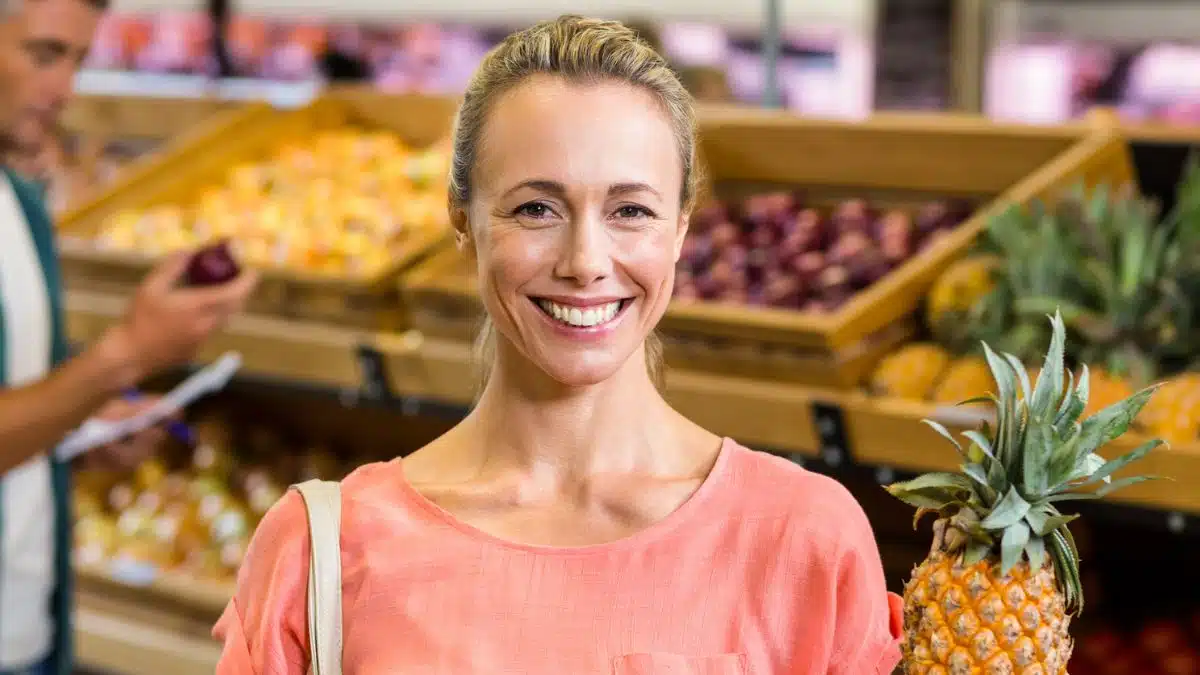 woman holding pineapple
