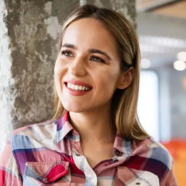 woman leaning on a tree