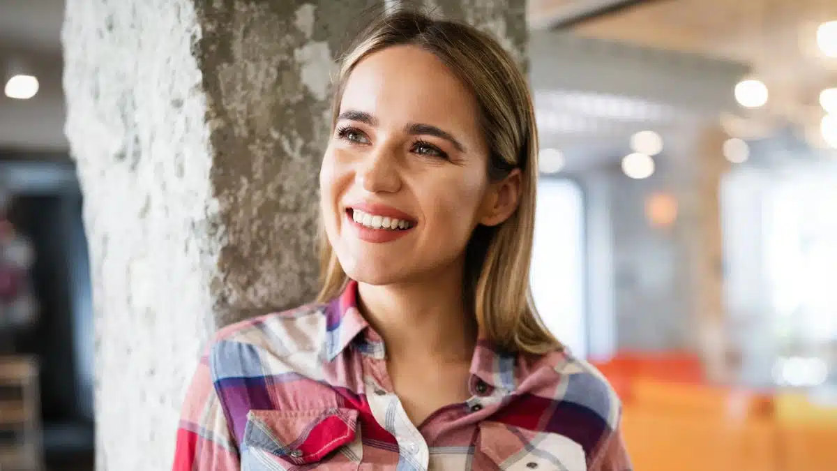 woman leaning on a tree