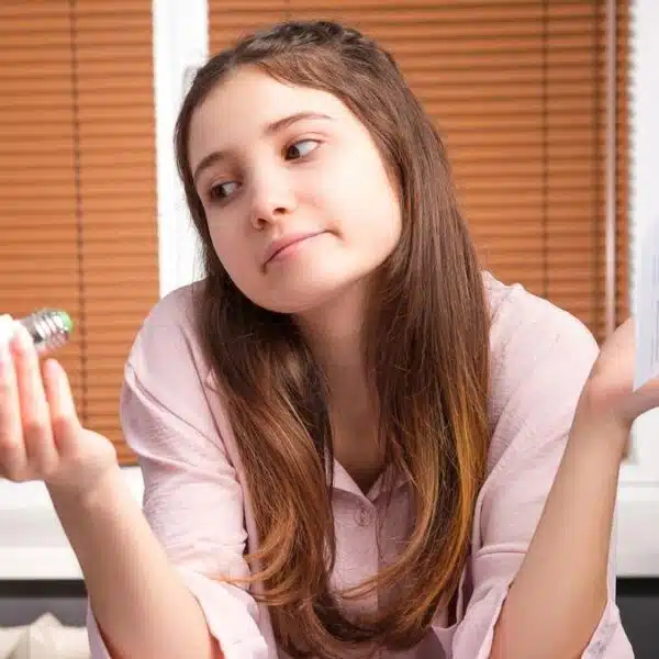 woman looking at her electricity bill