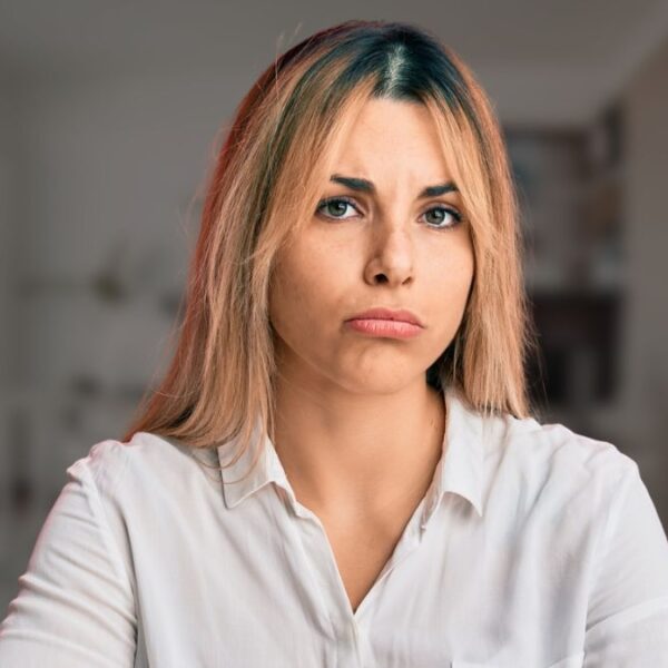 woman sad in her home office