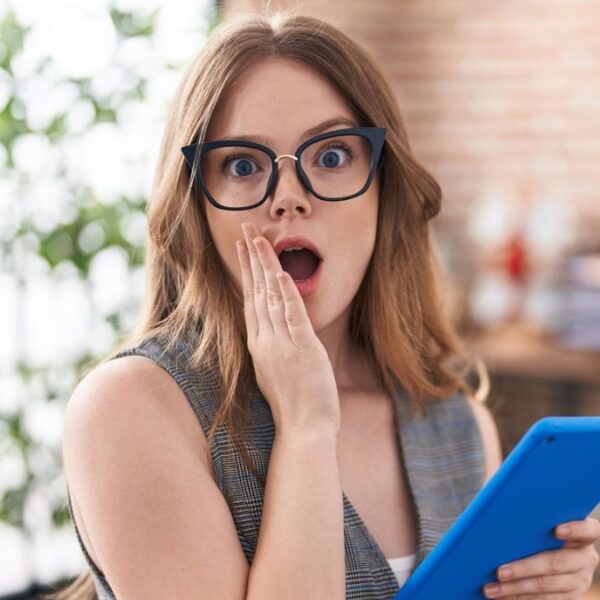 woman shocked glasses tablet