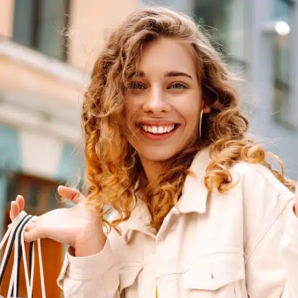 woman shopping holding bags in the street