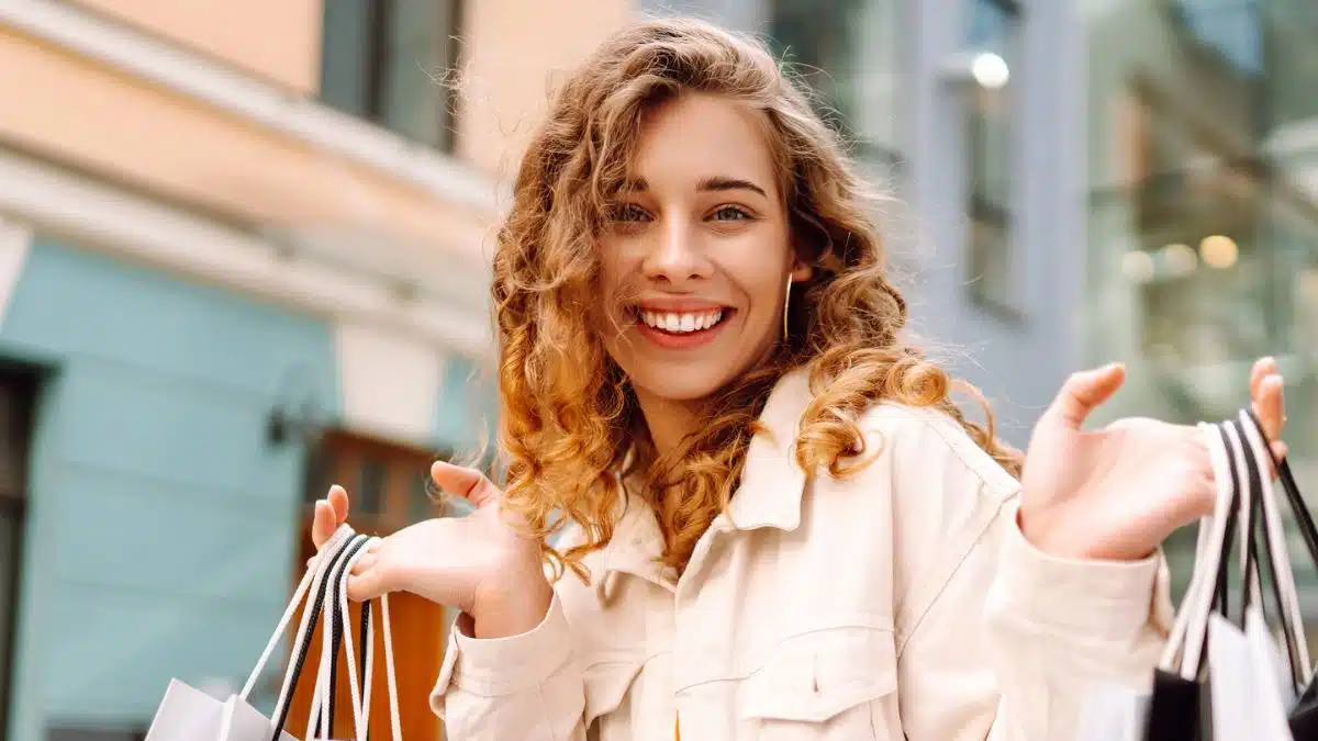 woman shopping holding bags in the street