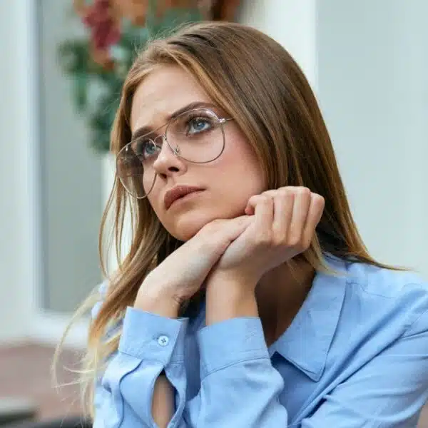 woman sitting at a table outside