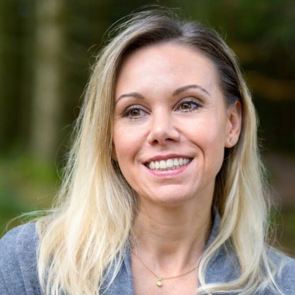 woman standing in the woods