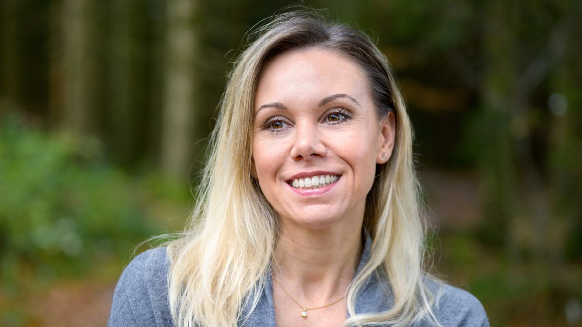 woman standing in the woods