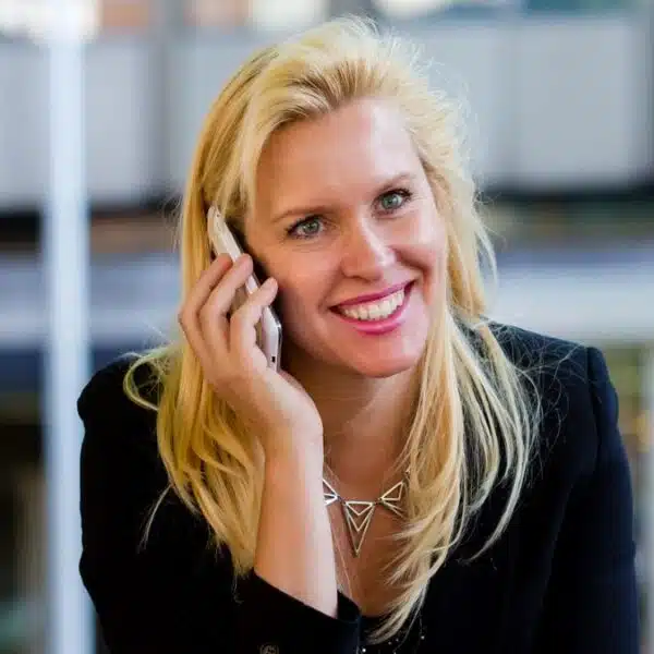 woman talking on her phone outside sitting