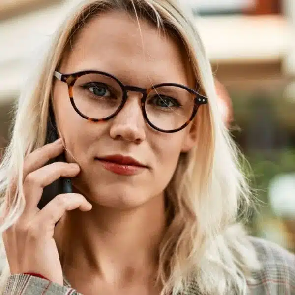woman talking on phone with glasses