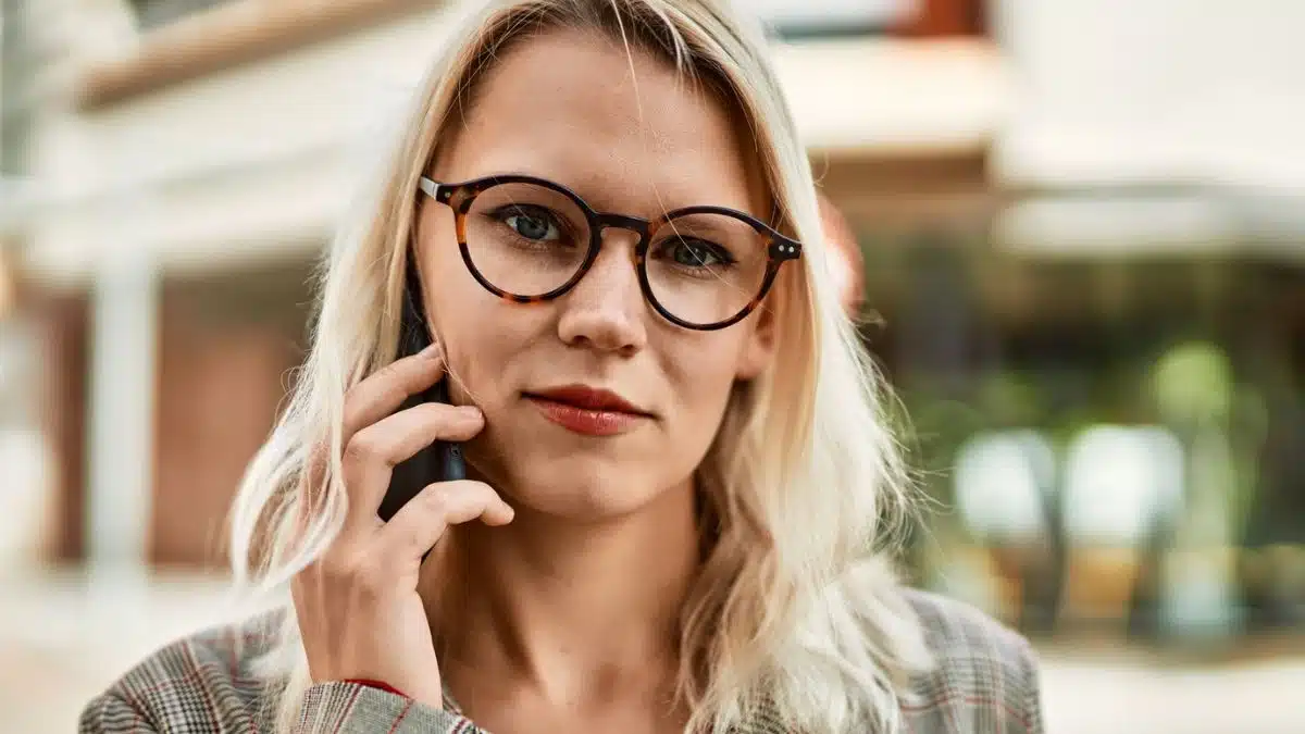 woman talking on phone with glasses