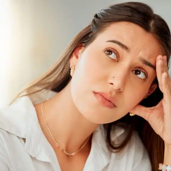 woman thinking to herself brunette