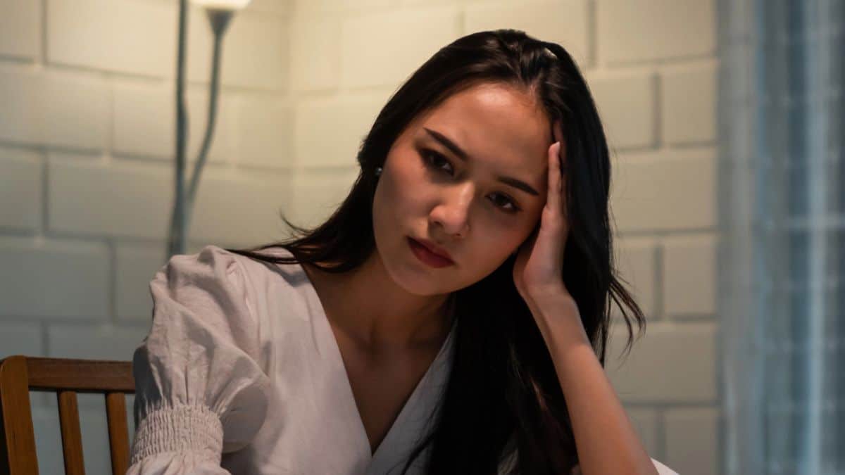 woman upset at table stress