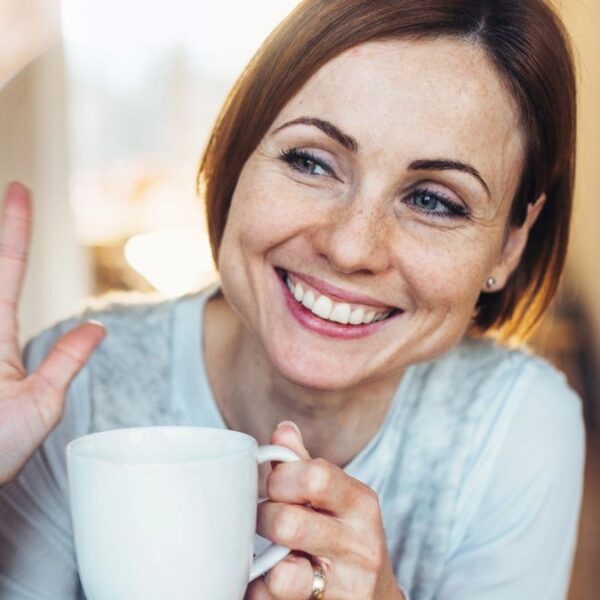 woman waving out the window