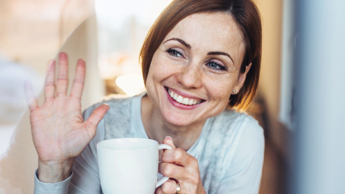 woman waving out the window