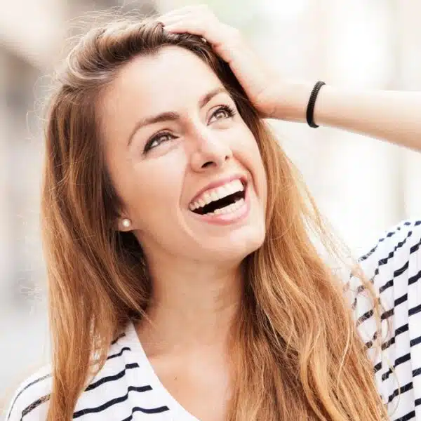 woman with big smile outside