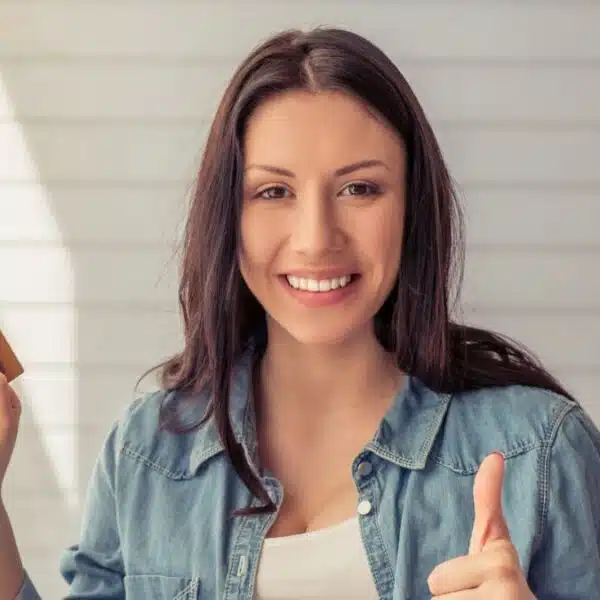 woman with her credit card and laptop at home