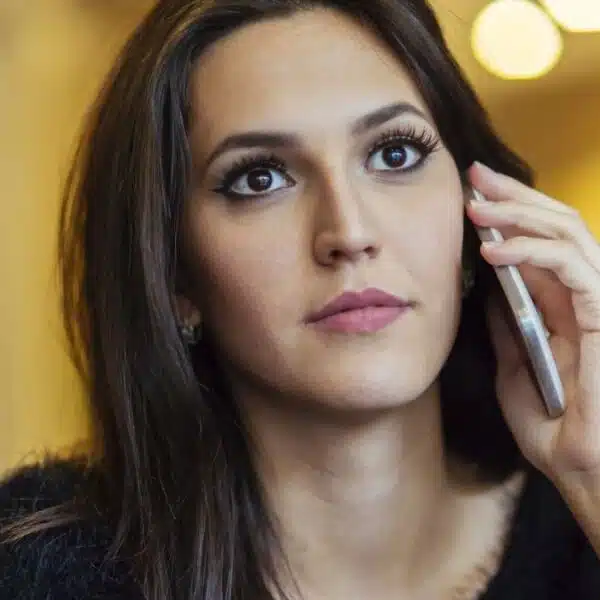 woman worried on phone