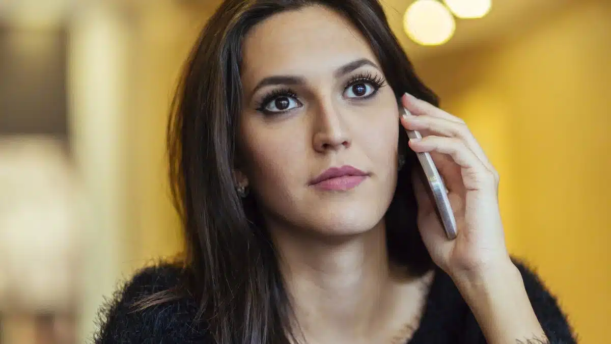 woman worried on phone