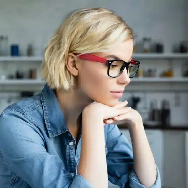 young woman glasses working at her desk