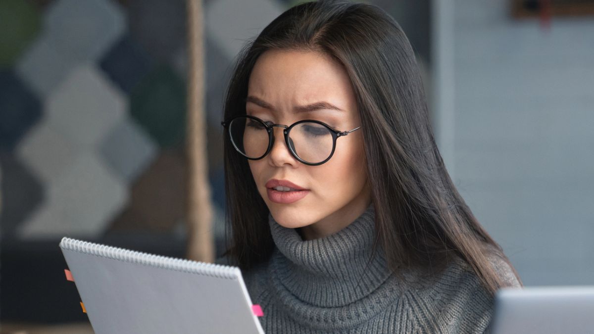 asian woman glasses office sweater