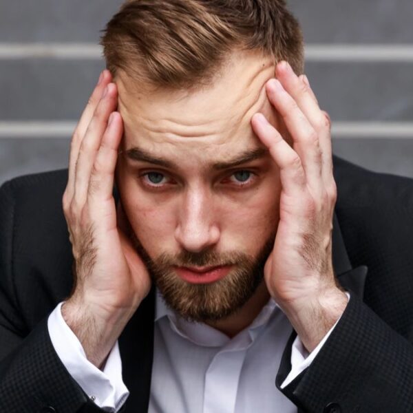 business man stress on the steps