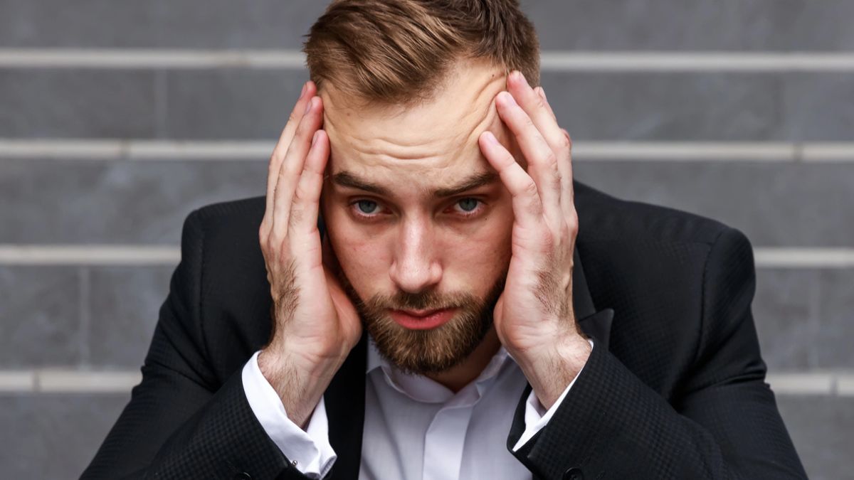 business man stress on the steps