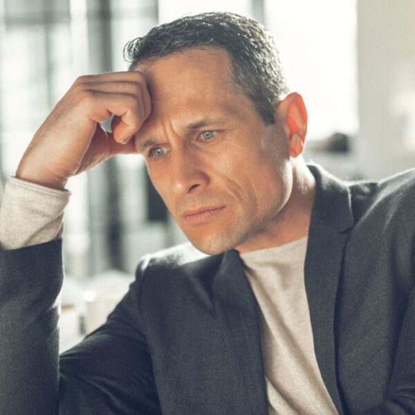 business sitting at desk with problems